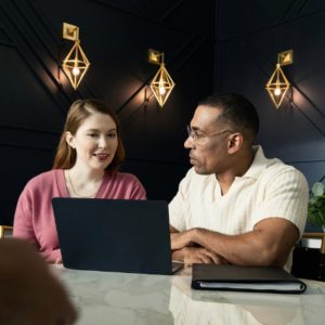 couple looking at their laptop