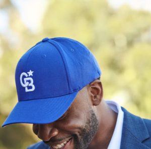 black guy in a blue cap